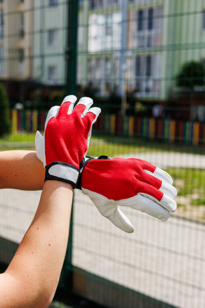 This closeup shows highperformance athletic gloves in red and white, offering enhanced grip and comfort for sports and outdoor activities, perfect for active individualsの写真素材