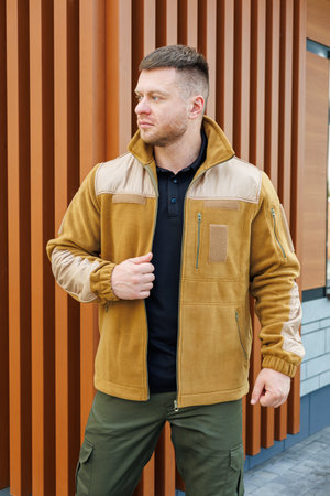 A model showcases a stylish, warm jacket perfect for outdoor activities or casual wear. Ideal blend of comfort and durability for modern lifestylesの写真素材
