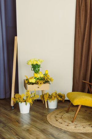 Bright yellow flowers enhance a cozy modern interior design and uplift any living space with a delightful and charming touch of nature that undeniably brings joy and warmthの写真素材