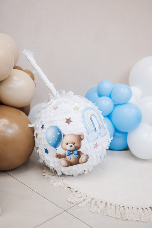 Large photo zone for a children's birthday party with helium white balloons. Bright celebration of a children's birthday party with blue balloons.の写真素材