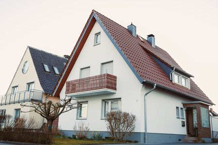 Exterior facade of the house. Landscape design of the house area. European house. Roof on the house made of tiles.の写真素材