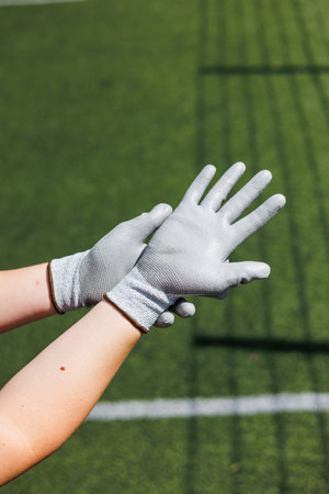 Rough gloves on hands. Durable gloves for dirty work.の写真素材