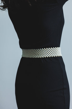 Exquisite pearl belt for an elegant look. Women's pearl belt. Stylish women's accessories.の写真素材