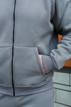 This trendy gray tracksuit features a unique texture, ideal for fitness lovers who value style. Perfect for workouts or casual outings, it combines comfort and fashionの写真素材