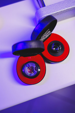 Closeup of luxurious earrings in elegant red and black cases, highlighting their intricate designs...