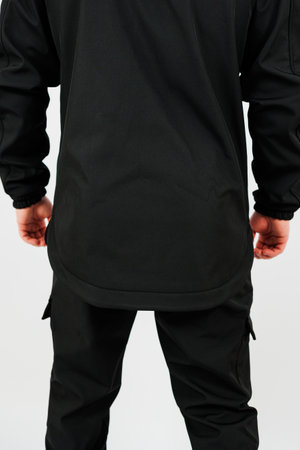 This sleek black athletic outfit features a stylish long shirt and comfortable cargo pants, perfect for casual outings or workouts. Embrace comfort and fashionの写真素材