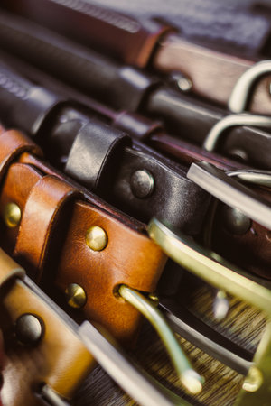 Discover a stylish collection of premium leather belts in vibrant colors, featuring unique metallic buckles to elevate your outfits and enhance your overall styleの写真素材
