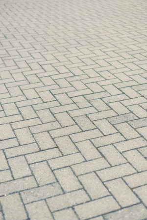 Here is a closeup of a beautifully arranged patterned pavement, highlighting the charm and...