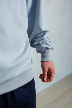 A stylish long-sleeve athletic shirt featuring a textured cuff design, perfect for workout or casual wear. Ideal for fitness enthusiasts and fashion-forward individuals.の写真素材