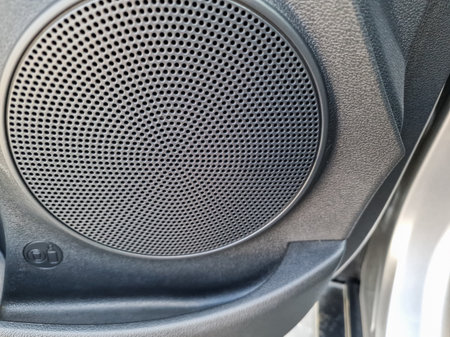 This premium car speaker boasts an intricate mesh design and durable construction, making it perfect for significantly enhancing audio experiences across a wide range of vehiclesの写真素材