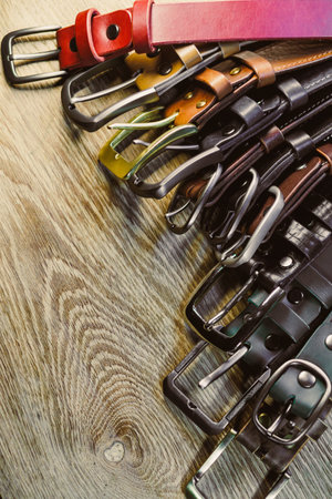 Discover a variety of fashionable belts in vibrant colors and quality materials, featuring stylish buckles to enhance your wardrobe and accessorize outfits beautifullyの写真素材