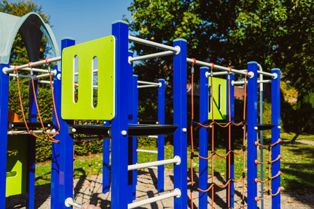 A vibrant playground stands in the heart of a cheerful park, inviting children to engage in play....