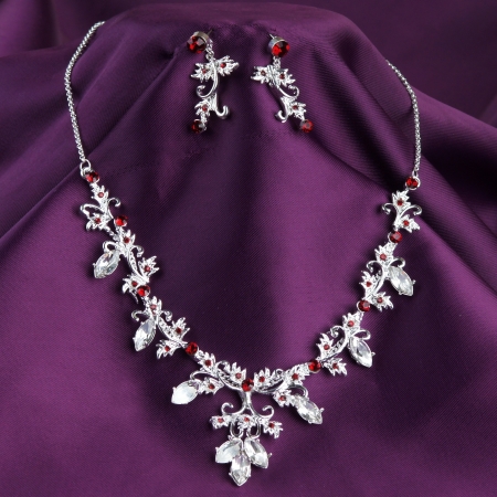 fashion necklace and earrings on purple silk backgroundの写真素材