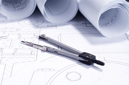 part of engineering project. rolls of blueprints and toolsの写真素材