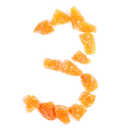 number 3 written with slices of dried sweet fruitsの写真素材
