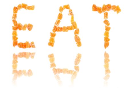 word eat with a reflection written with letters made of sugary sweet slices of gingerの写真素材