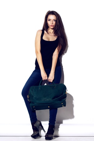 young beautiful girl holding reptile leaher bagの写真素材