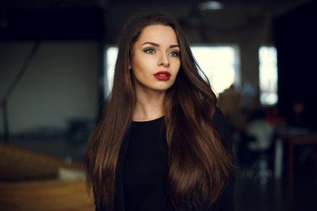 Portrait of young beautiful pretty woman wearing stylish pullover. Upper body shotの写真素材