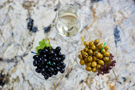 Appetizer. Tasty olives in glass.の写真素材