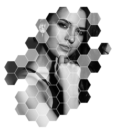 Young sexy slim tanned woman in black swimsuit posing against blue background. Closeup Fashion portrait of beautiful girl with long wavy brunette hair. Swimwear or bikini modelの写真素材