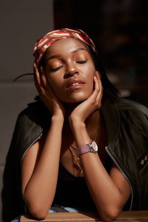 Lifestyle outdoor portrait of beautiful pretty stylish sensual african woman wearing jeans and shirt...