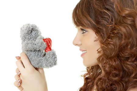 Sexy girl isolated on white with teddy bearの写真素材