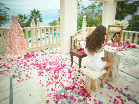 Gorgeous, lovely bride, model preparing to wedding day. Dream wedding with lot of flowers, shiny and ethereal.の写真素材