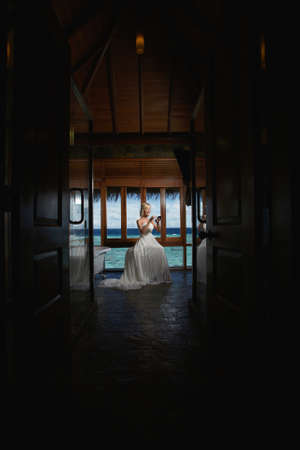 Lovely bride making dream preparation and spa procedure before wedding. Unique Maldives or Bora Bora beauty.の写真素材