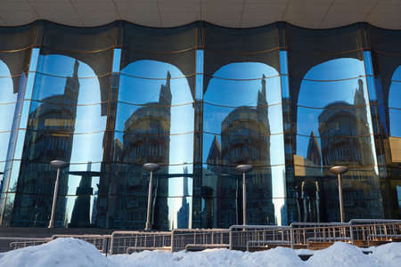 The glass facade of curved blue glass