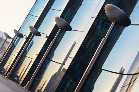 The glass facade of curved blue glassの写真素材