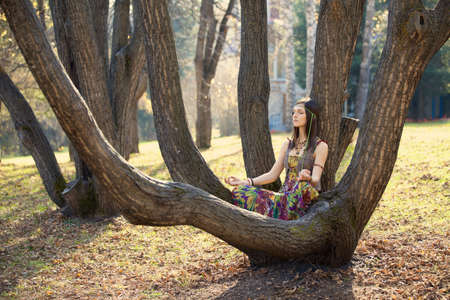 Hippie Girl and treeの写真素材