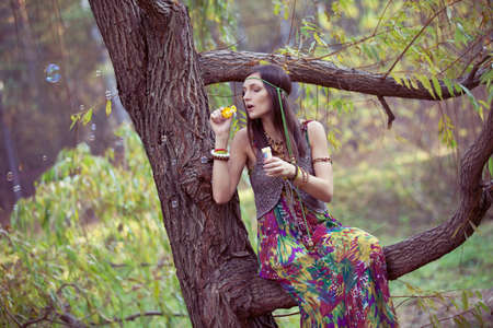 Hippie Girl and treeの写真素材