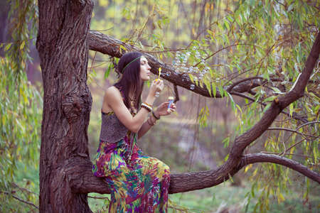 Hippie Girl and treeの写真素材