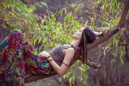 Hippie Girl and treeの写真素材