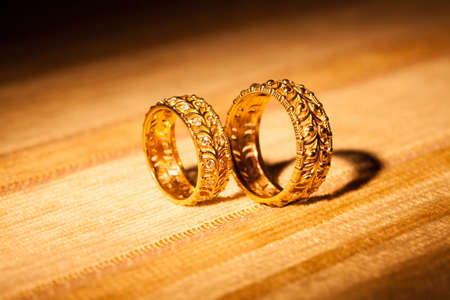 Wedding rings on a yellow backgroundの写真素材