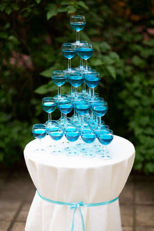 Pyramid of glasses of champagne. hill.の写真素材