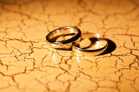 Wedding rings on a yellow backgroundの写真素材