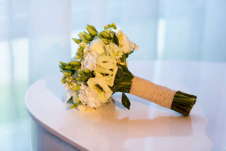 Wedding bouquet on the white pianoの写真素材