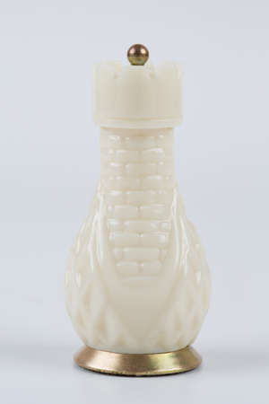 Glass chess pieces on a white backgroundの写真素材