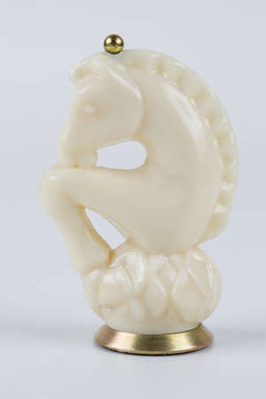 Glass chess pieces on a white backgroundの写真素材