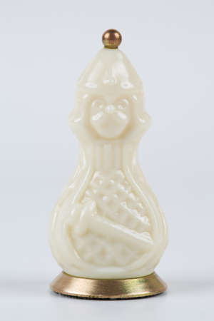 Glass chess pieces on a white backgroundの写真素材