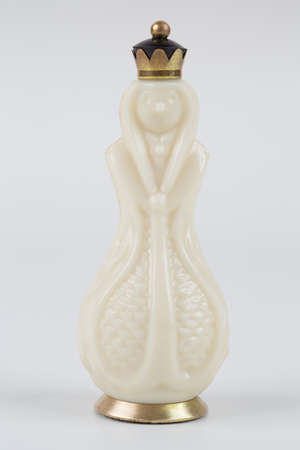 Glass chess pieces on a white backgroundの写真素材