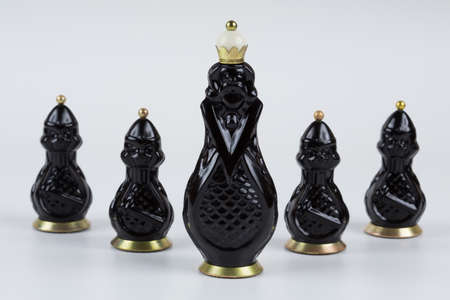 Glass chess pieces on a white backgroundの写真素材