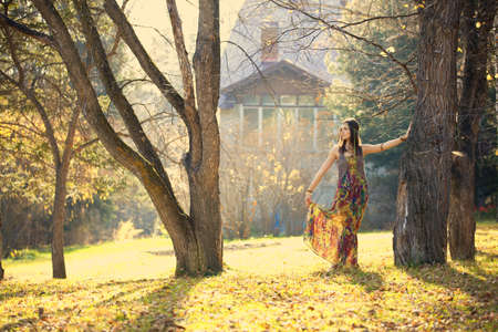 Hippie Girl at home and treesの写真素材