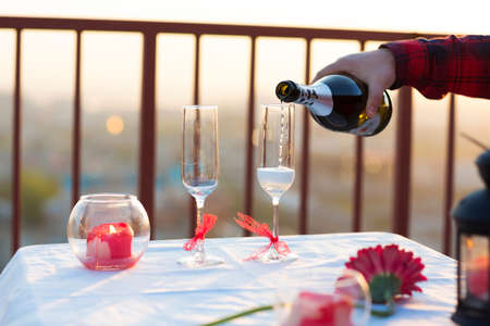 Romantic dinner on the roof at sunsetの写真素材