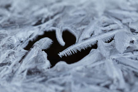 Water ice crystals and black waterの写真素材