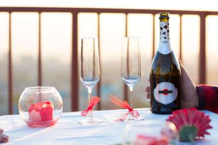 Romantic dinner on the roof at sunsetの写真素材