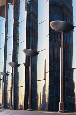The glass facade of curved blue glassの写真素材