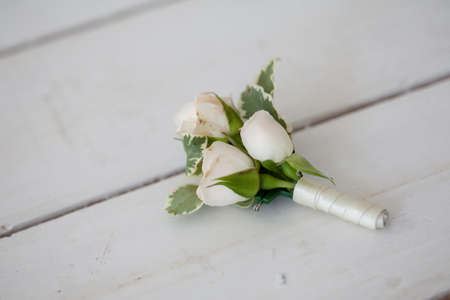 Wedding boutonniere of white orchids.の写真素材