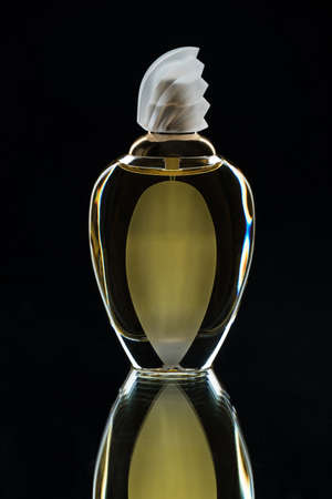 Glass bottle for perfume on a black background.の写真素材
